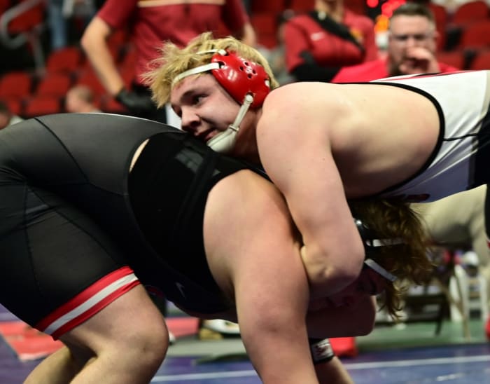 Waverly-Shell Rock's Bas Diaz (right) circles the mat during a 150-pound match during the Class 3A semifinals against Johnston's Caden Leonard at the IHSAA state tournament on Thursday at Wells Fargo Arena in Des Moines. (Photo by Ryan Timmerman)